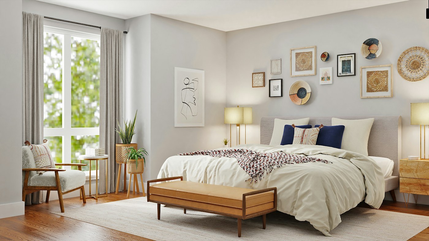 A calm bedroom with light bedding and plants